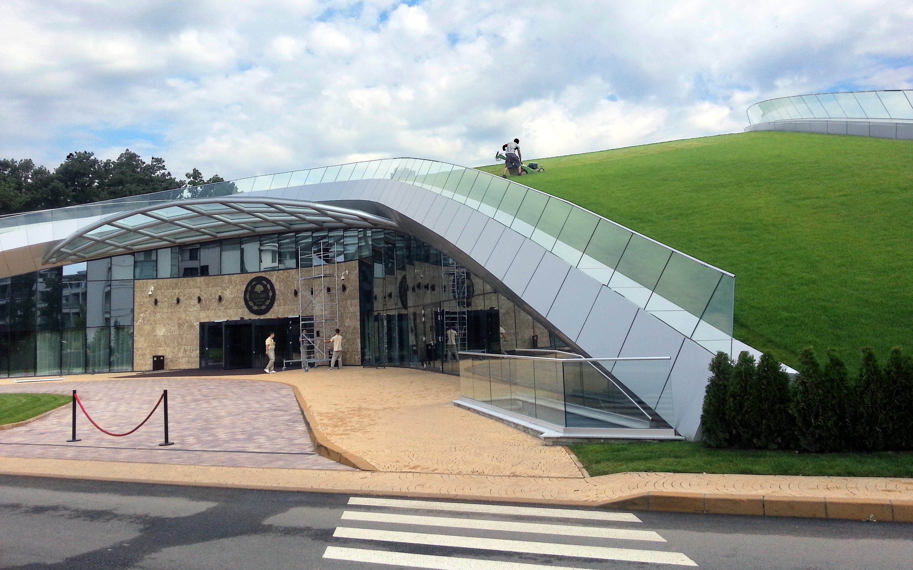 Building with an arched green roof with lawn